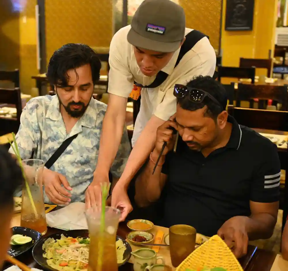 Evening street food walking tour in lantern-lit Hoi An