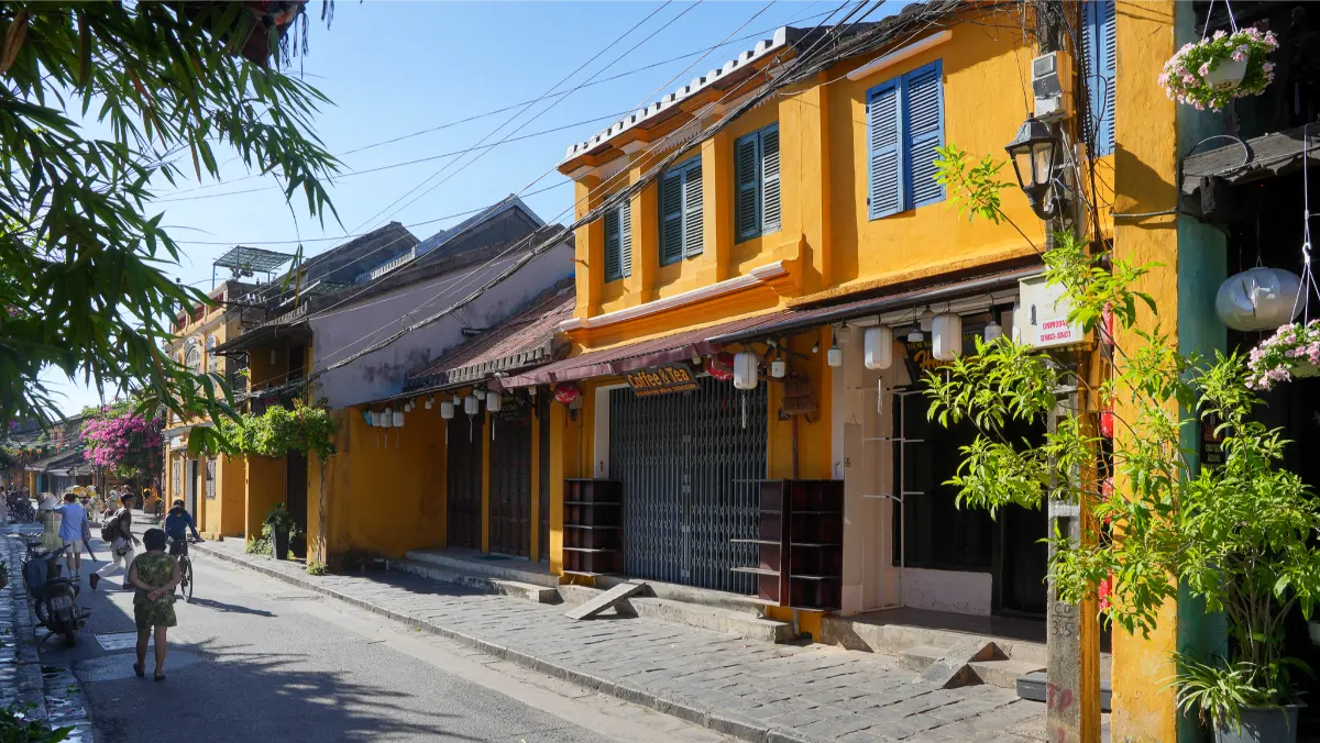 Quiet yellow-walled street in Hoi An Ancient Town.